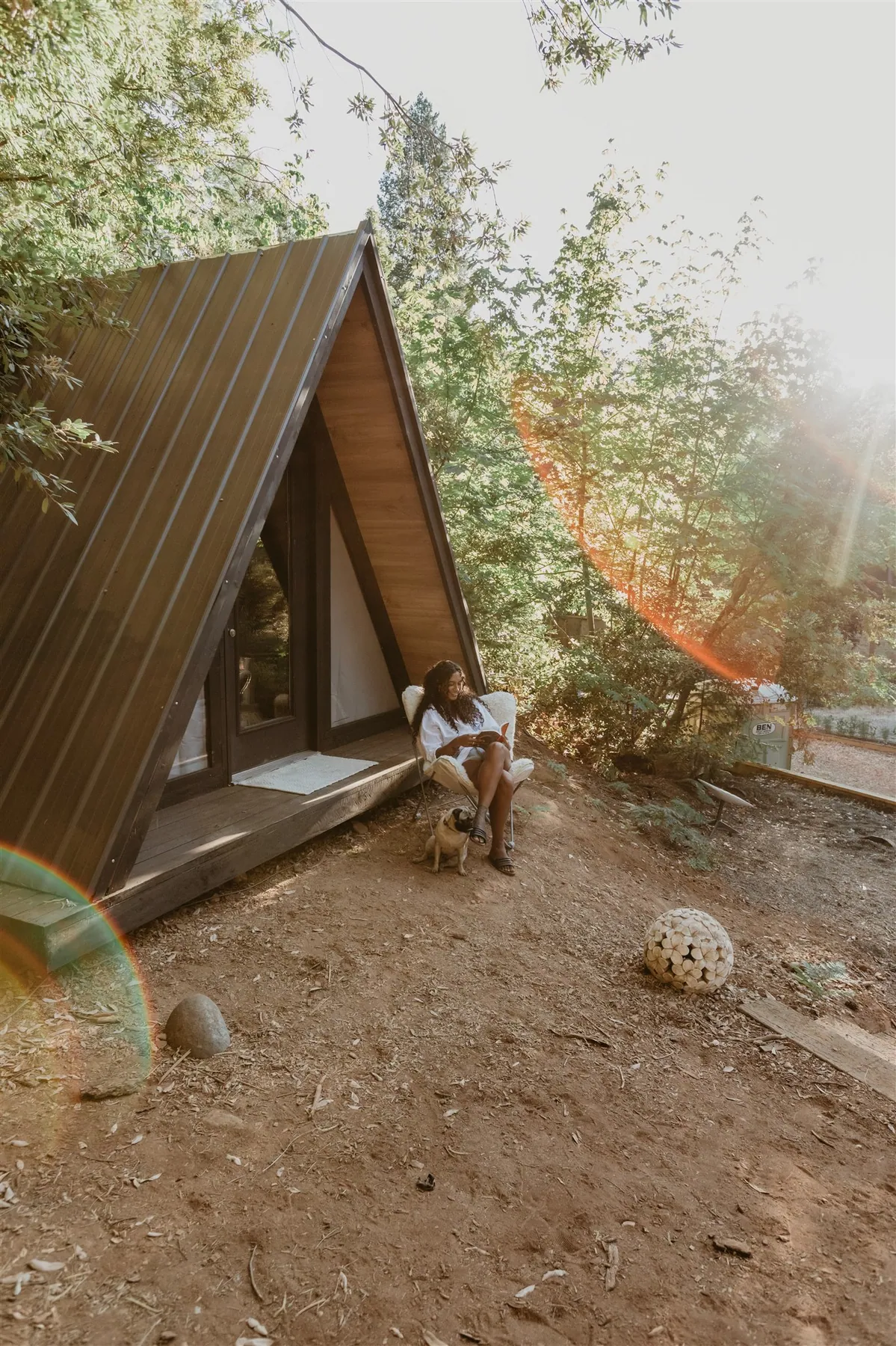 The A-frame cabin on the property at golden hour