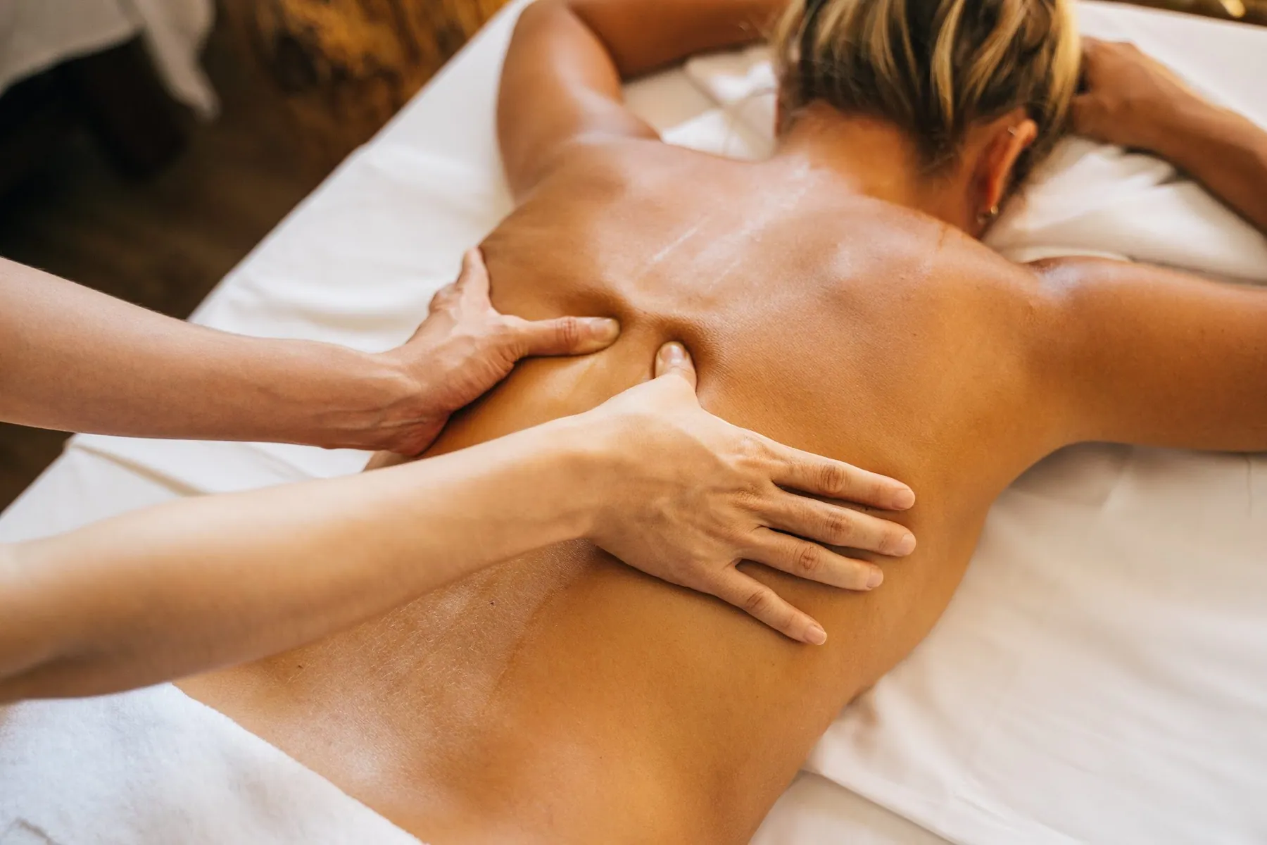 A guest receiving a massage during a spa treatment