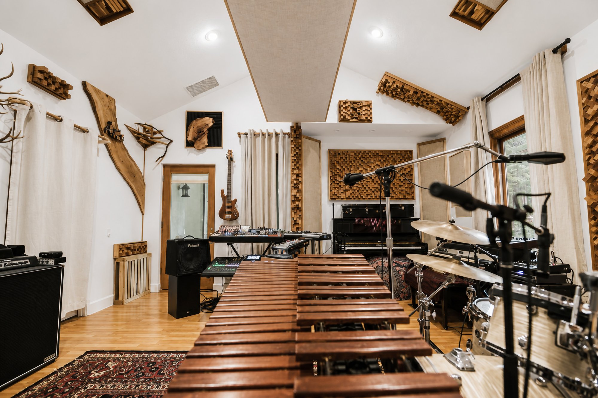 A marimba running down the middle of the live room with the drum kit set up behind