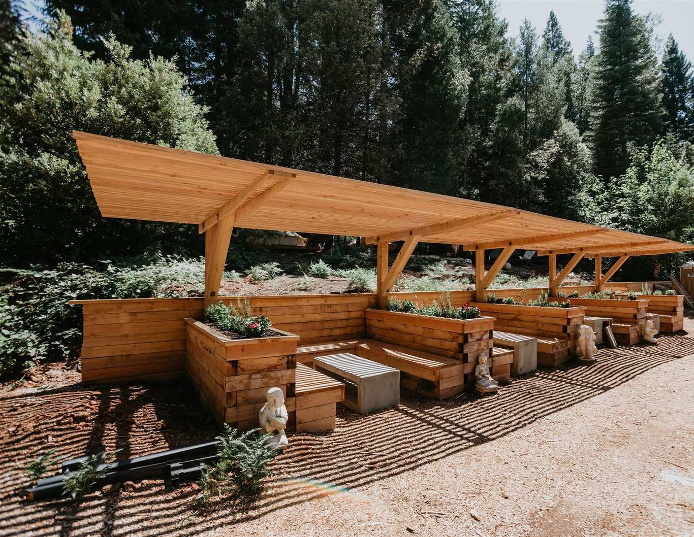 Cedar raised-bed growing pavilion under the redwoods